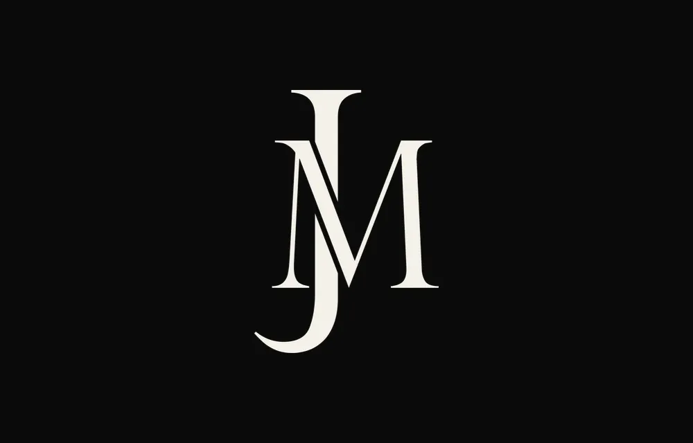 The monogram in cream on black.