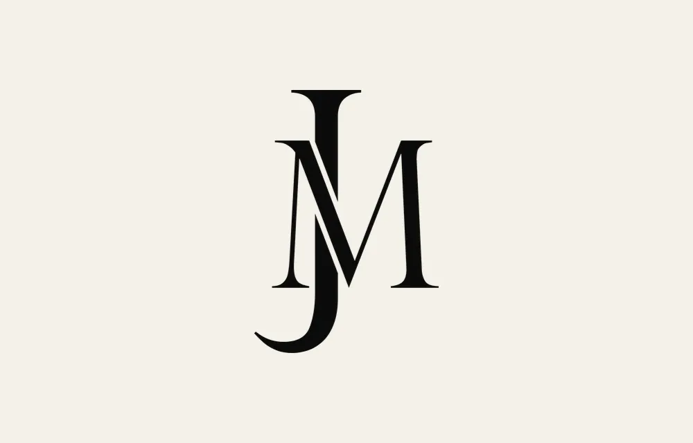 The monogram in black on cream.
