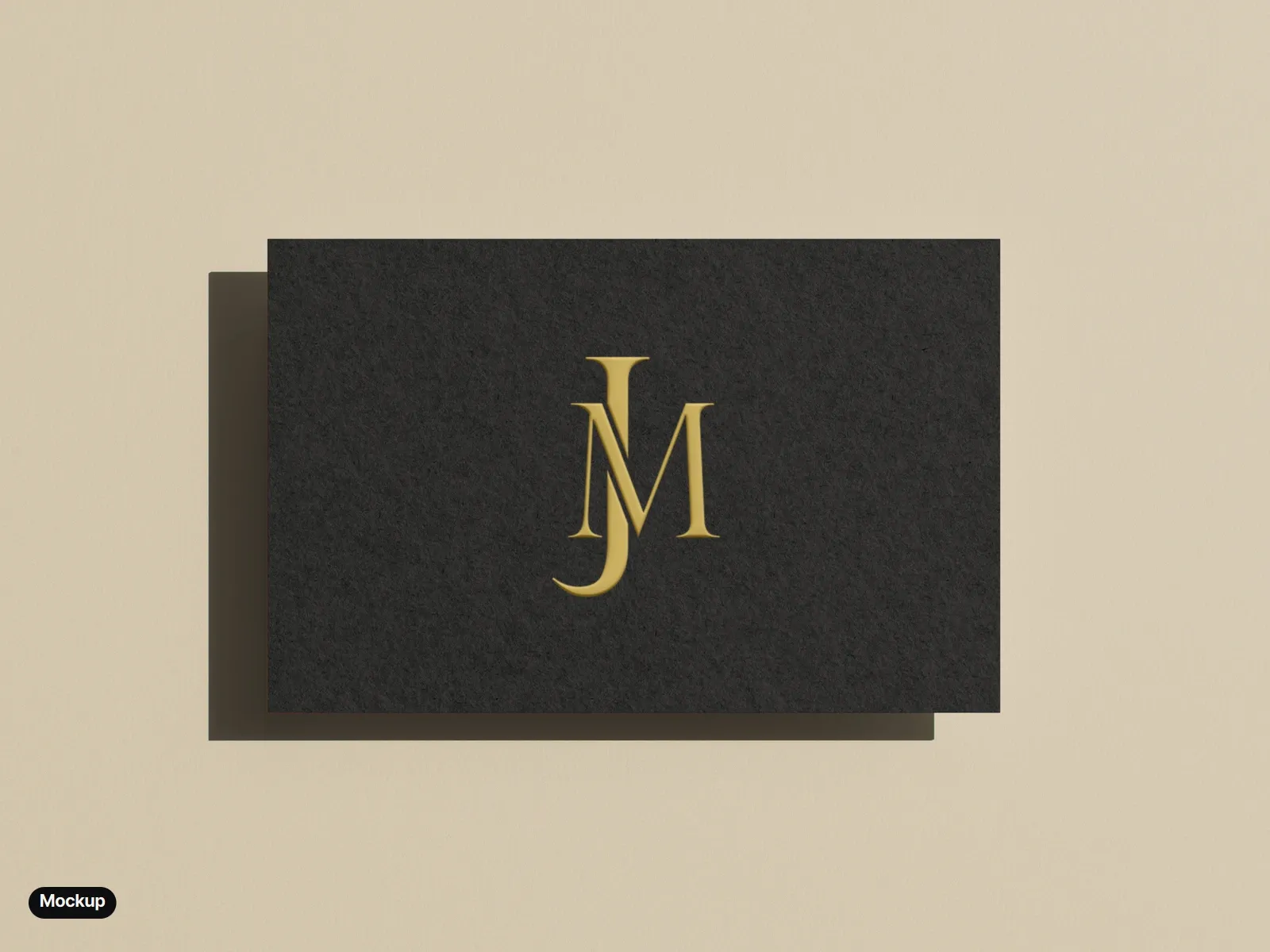 Mockup: a black business card on a warm beige ground, the monogram printed in gold and embossed.