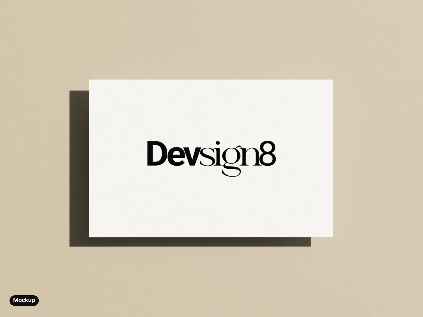 Mockup: a cream business card on a warm beige ground, the wordmark printed in black and embossed.