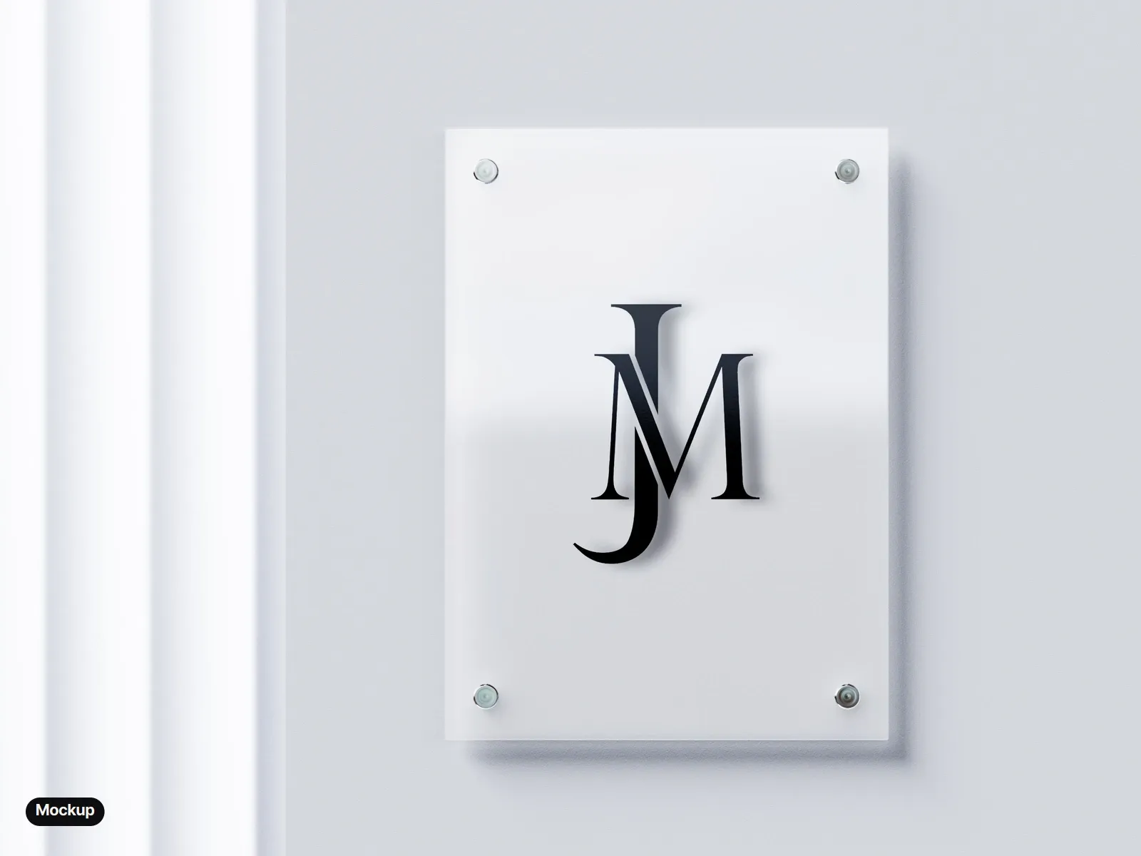 Mockup: a frosted glass sign plate on four steel standoffs with the black monogram, on a pale wall.